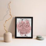 God Will Provide Philippians 4:19 Christian Wall Art with soft pink floral design Wall Art displayed on the wall in black frame