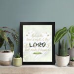 Infidu Isaiah 60:22 Christian wall art with gold text on mint green background, featuring LORD in larger black and beige letters. Wall Art displayed on the table in a black frame