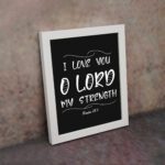 I LOVE YOU O LORD MY STRENGTH white text on black background in modern style - Christian wall art for home decor displayed on the wall in a white frame