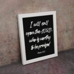 I Will Call Upon The Lord, Who Is Worthy To Be Praised Psalm 18:3 Bible Wall Art in white text with black background and black frame. displayed on the wall in a white frame