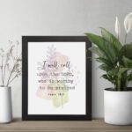 Psalm 18:3 Bible Wall Art with a soft pastel background and light green and beige leaves, featuring dark, elegant text. Wall Art hung on the table in a black frame