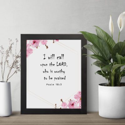 I Will Call Upon The Lord Psalm 18:3 Bible Verse Wall Art with black text on a white background, featuring pink floral decorations in the corners. Wall Art displayed on the table in a black frame