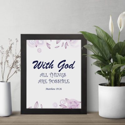 With God All Things Are Possible Matthew 19:26 Bible Verse Wall Art with purple text and light purple floral accents on a white background. Wall Art displayed on the table in a black frame