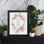 Psalm 50:15 Bible Wall Art with elegant black text, botanical patterns, and pink watercolor accents on a pale white background. Wall Art displayed on the table in a black frame