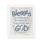 Infidu Matthew 5:8 Christian wall art with blue text on a white background, featuring a subtle pastel floral design and stylized GOD. Wall Art hung on the wall in a white frame