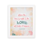 Infidu Isaiah 60:22 Christian wall art with coral and teal text, teal LORD, and a soft pastel watercolor background with floral shapes. Wall Art hung on the wall in a white frame