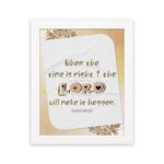 Christian wall art featuring Isaiah 60:22 with elegant text and a peach background, highlighting 'The Lord will make it happen. Wall Art hung on the wall in a white frame