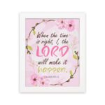 Isaiah 60:22 Christian Wall Art - When The Time Is Right, I, The Lord Will Make It Happen with floral design in pink and green. Wall Art hung on the wall in a white frame