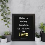 Joshua 24:15 Bible verse wall art with LORD in yellow on a black background. Inspiring Christian home decor by Infidu. Wall Art displayed on the wall in a black frame