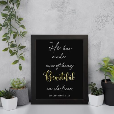 Ecclesiastes 3:11 Bible verse wall art with Beautiful yellow script on a black background. Inspiring Christian decor by Infidu. Wall Art displayed on the wall in a black frame