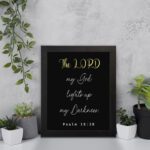 Psalm 18:28 Bible verse wall art with The LORD in yellow on a black background. Christian decor by Infidu. Wall Art on the wall in a black frame