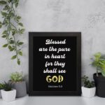 Bible verse wall art with black background, yellow and white font, featuring Matthew 5:8 verse black frame displayed on the wall