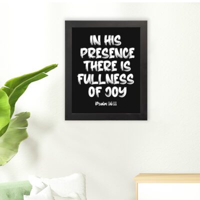 In His Presence There Is Fullness of Joy in bold white block letters with Psalm 16:11 on black background hung on the floor in a black frame - Christian wall art.