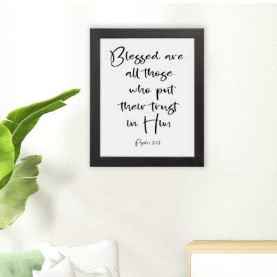 Blessed Are All Those Who Put Their Trust In Him Psalm 2:12 black cursive text on white background - Christian wall art hung on the floor in a black frame