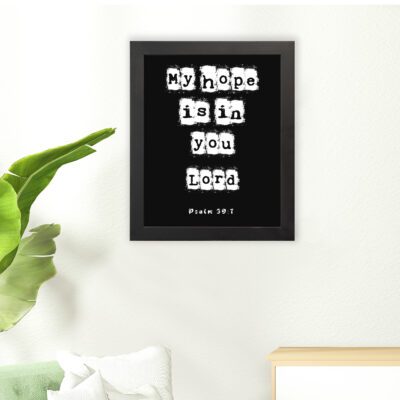 My Hope Is In You Lord' Psalm 39:7 Bible verse wall art with white squares on a black background. Wall Art hung on the floor in a black frame