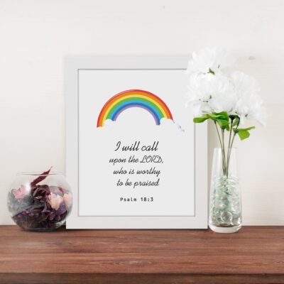 I Will Call Upon The Lord Psalm 18:3 Bible Wall Art with a colorful rainbow at the top and black text on a white background. Wall Art displayed on the table in a white frame