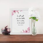 I Will Call Upon The Lord Psalm 18:3 Bible Verse Wall Art with black text on a white background, featuring pink floral decorations in the corners. Wall Art displayed on the table in a white frame