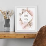 Psalm 50:15 Bible Wall Art with elegant black text, botanical patterns, and pink watercolor accents on a pale white background. Wall Art displayed on the table in a white frame