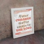 All Your Children Shall Be Taught By The Lord Isaiah 54:13 Christian Wall Art with red, brown, and beige tones. Wall Art displayed on the wall in a white frame