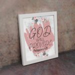 God Will Provide Philippians 4:19 Christian Wall Art with soft pink floral design Wall Art displayed on the wall in white frame