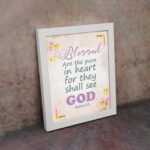 Blessed Are The Pure In Heart For They Shall See God Matthew 5:8 Christian Wall Art with floral accents Wall Art displayed on the wall in a white frame