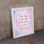 Infidu Jeremiah 18:6 Christian wall art with purple and pink cursive text, bold 'MY,' and a pastel watercolor background with a blue vine frame. Wall Art displayed on the wall in a white frame