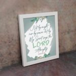 Infidu Zechariah 4:6 Christian wall art with decorative design and floral accents, featuring Not by Might, But by My Spirit. wall art hung on the wall in a white frame