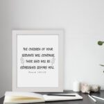 Bible verse wall art with Psalm 102:28 in black text on a white background, featuring decorative leaf designs for an elegant touch. displayed on the table in a white frame