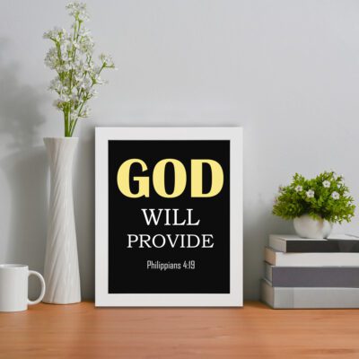 Christian wall art with Philippians 4:19 verse on a black background, yellow and white font black frame displayed on the table