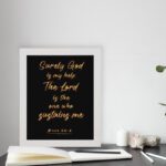 Infidu wall art with golden text reading 'Surely God is my help; The Lord is the one who sustains me' - Psalm 54:4. displayed on the table in a white frame