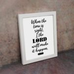 Infidu wall art displaying When the time is right, I, the LORD will make it happen in black text on a white background. displayed on the wall in a white frame