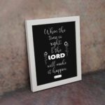 Infidu wall art displaying When the time is right, I, the LORD will make it happen with emphasis on "LORD" in large text. displayed on the wall in a white frame