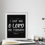 I LOVE YOU O LORD MY STRENGTH white text on black background in modern style - Christian wall art for home decor displayed on the table in a white frame