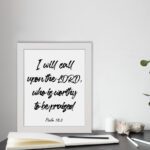 I Will Call Upon The Lord Psalm 18:3 Christian wall art with bold script font on a white background. Wall Art displayed on the table in a white frame