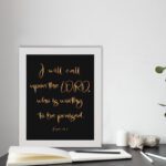 Psalm 18:3 wall art with gold text I will call upon the Lord on a black background in a black frame. Christian home decor. displayed on the table in a white frame