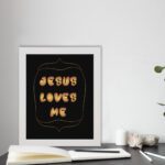 I Am a Child of God Bible wall art with bold gold text and a decorative gold border on a black background. Wall Art displayed on the table in a white frame