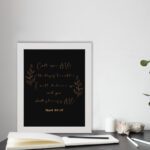 Infidu Call Upon Me In The Day Of Trouble Psalm 50:15 Bible Wall Art with gold text on a black background and subtle leaf illustrations. Wall Art displayed on the table in a white frame