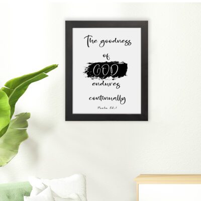 Infidu The Goodness Of God Endures Continually Psalm 52:1 Bible Wall Art with black text and brushstroke design on white background. Wall Art hung on the floor in a black frame