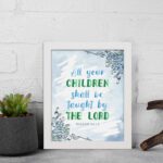 Isaiah 54:13 Christian wall art with blue sky background and leaf designs, featuring the verse All your CHILDREN shall be taught by THE LORD. Wall Art displayed on the wall in a white frame