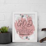 God Will Provide Philippians 4:19 Christian Wall Art with soft pink floral design Wall Art displayed on the wall in white frame