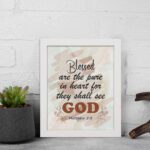 Blessed Are The Pure In Heart For They Shall See God Matthew 5:8 Christian Wall Art with earthy tones and splattered texture. Wall Art hung on the wall in a white frame