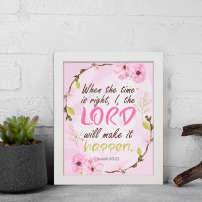 Isaiah 60:22 Christian Wall Art - When The Time Is Right, I, The Lord Will Make It Happen with floral design in pink and green. Wall Art displayed on the wall in a white frame