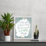 Infidu Zechariah 4:6 Christian wall art with decorative design and floral accents, featuring Not by Might, But by My Spirit. wall art displayed on the table in a white frame