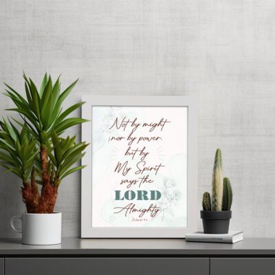 Zechariah 4:6 Christian Wall Art with minimalist design, dark brown text, and teal LORD on a light white floral background. Wall Art displayed on the table in a white frame