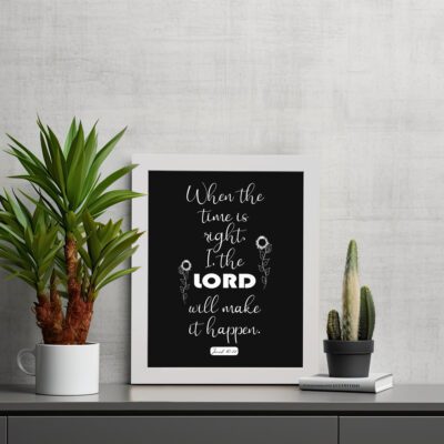 Infidu wall art displaying When the time is right, I, the LORD will make it happen with emphasis on "LORD" in large text. displayed on the table in a white frame