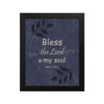 Christian wall art with purple-blue background, black leaf design, and white text Bless The Lord O My Soul Psalm 103:1 Bible Verse Wall Art black frame hung on the wall