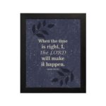 Christian wall art with Isaiah 60:22 verse on a purple-blue background with a leaf design and black frame hung on the wall