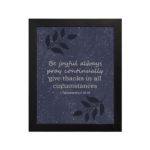 Infidu Be Joyful Always Pray Continually Give Thanks In All Circumstances 1 Thessalonians 5-16-18 Bible Verse Wall Art with purple-blue background, black leaf design, and white font black frame hung on the wall