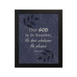 Christian wall art with Psalm 115:3 text on a Purple Blue Color background, black leaf design, white font black frame hung on the wall