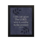 Christian wall art with a purple-blue background, black leaf design, and white font featuring Psalm 18:3 black frame hung on the wall